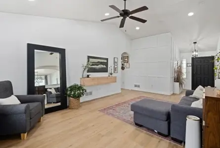 Modern living room featuring custom interior feature wall painting and precise trim detailing.